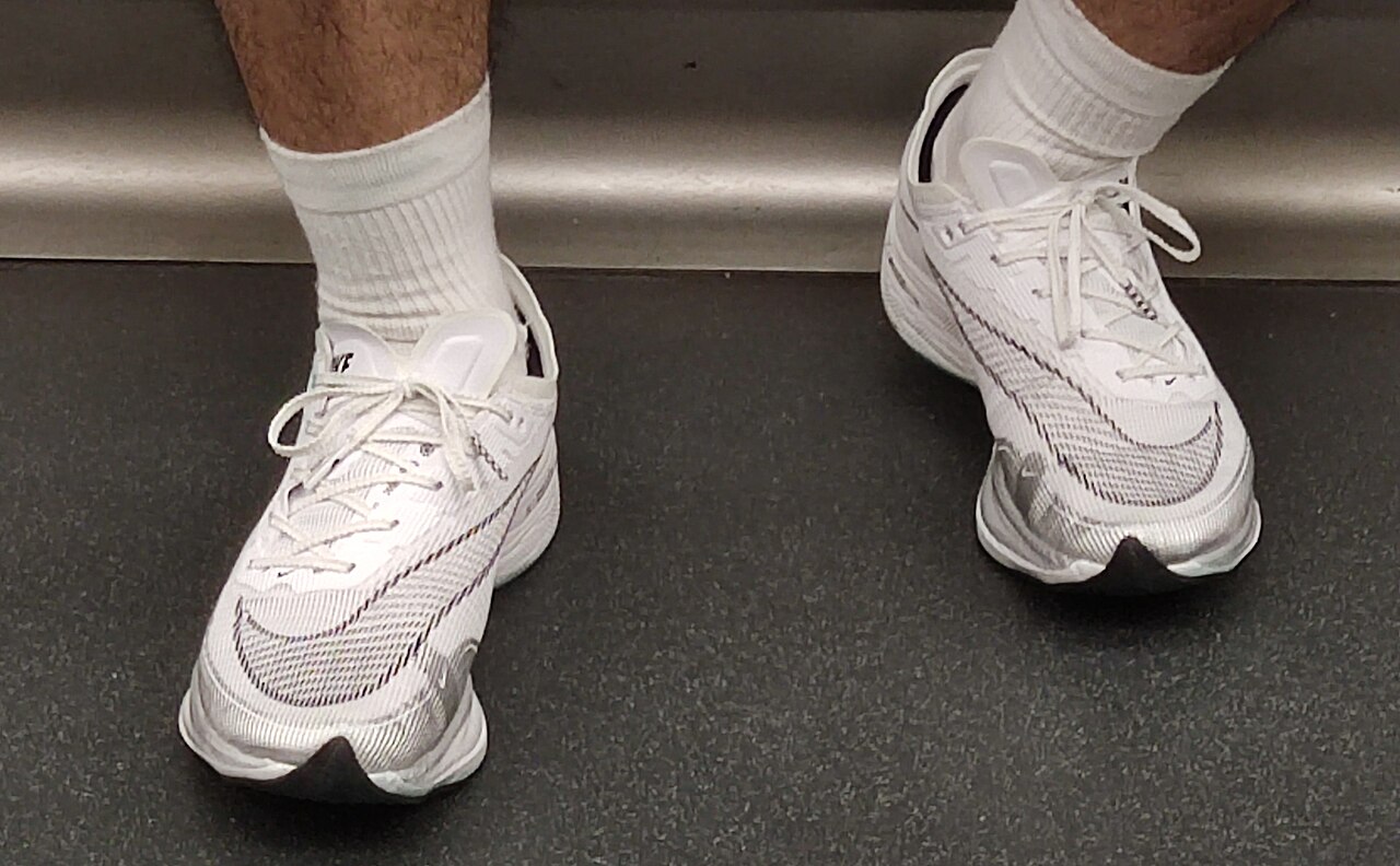 A pair of white Nike Vaporfly Next% running shoes